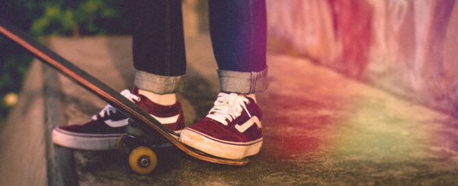 taking the first step to skateboard down a ramp